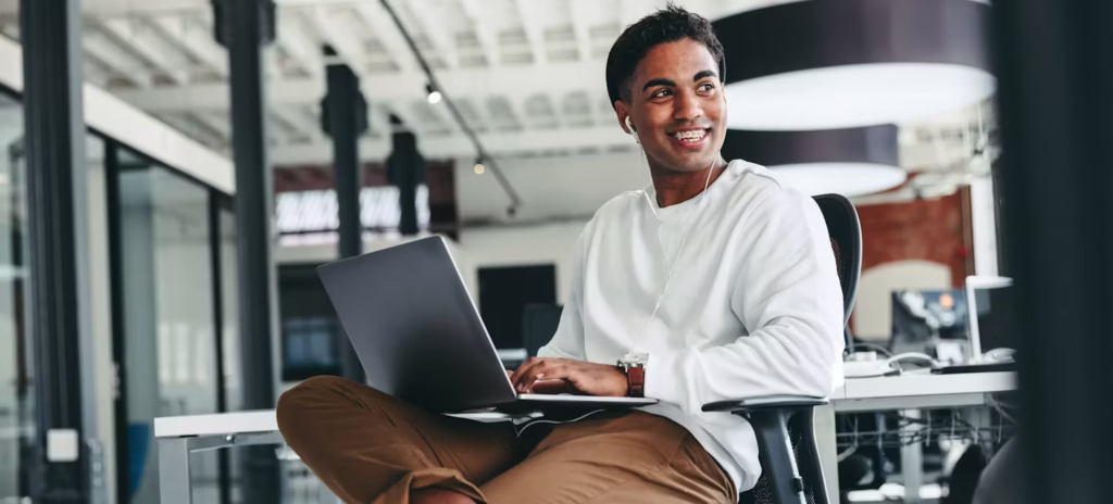 Man using laptop for cloud computing tasks